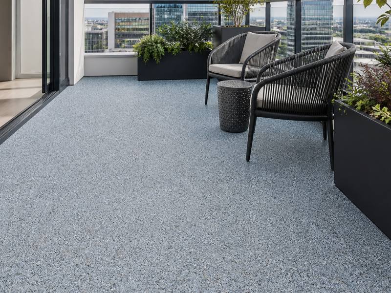 Grey rubber surfacing troweled over a condo balcony floor by Oakville Rubber Surfacing.